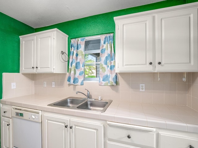 474 E Alluvial Ave Unit 139, Fresno, CA 93720 - kitchen featuring dishwasher, tile countertops, white cabinetry, and a sink