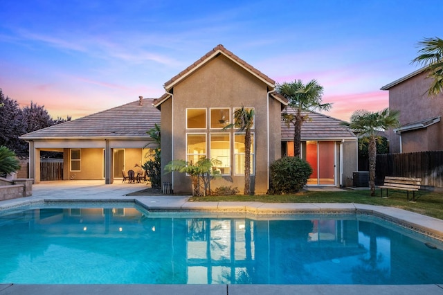 1698 E Wallington Ln, Fresno, CA 93730 - back of property with a tile roof, a patio, and stucco siding
