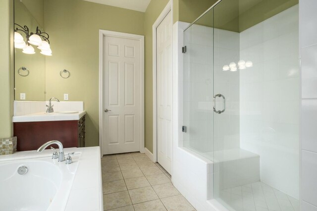 1698 E Wallington Ln, Fresno, CA 93730 - bathroom with a stall shower, vanity, tile patterned flooring, and a bath