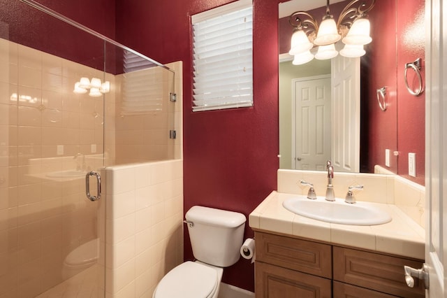 1698 E Wallington Ln, Fresno, CA 93730 - full bath with toilet, a chandelier, vanity, and a shower stall