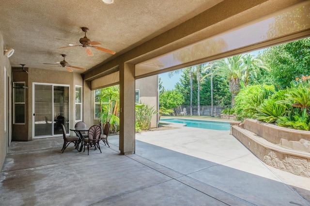 1698 E Wallington Ln, Fresno, CA 93730 - fenced backyard with a patio area and a ceiling fan
