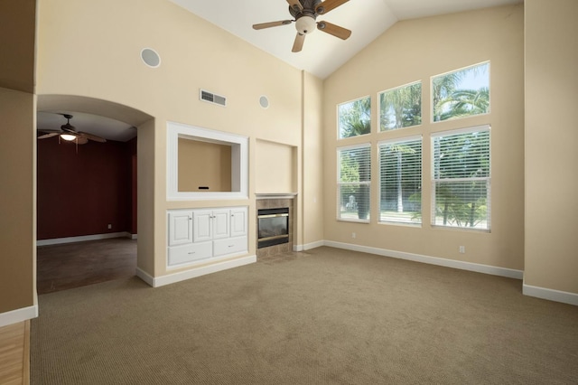 1698 E Wallington Ln, Fresno, CA 93730 - unfurnished living room with ceiling fan, carpet, a fireplace, baseboards, and high vaulted ceiling
