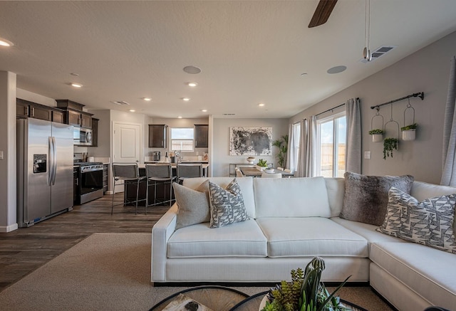 2058 Catherine Ave Unit 2046S, Sanger, CA 93657 - living area with healthy amount of natural light, dark wood-style floors, recessed lighting, and a ceiling fan