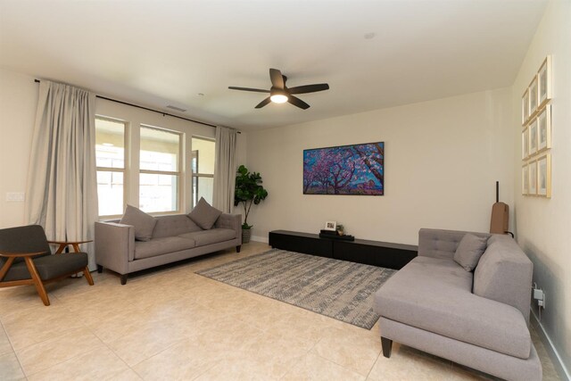 385 Fir St W, Madera, CA 93636 - living room featuring ceiling fan and light tile patterned floors