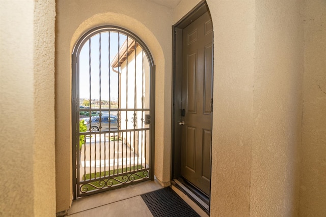 385 Fir St W, Madera, CA 93636 - doorway to outside featuring a textured wall and plenty of natural light