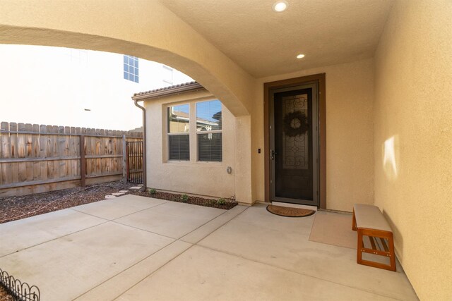 385 Fir St W, Madera, CA 93636 - entrance to property featuring stucco siding and a patio