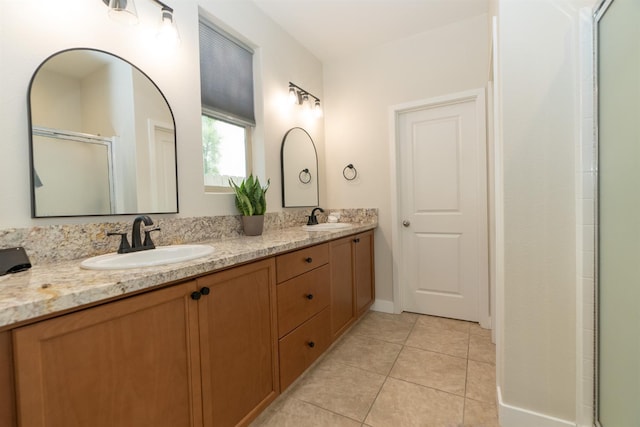 385 Fir St W, Madera, CA 93636 - bathroom featuring double vanity, tile patterned floors, and a shower with shower door