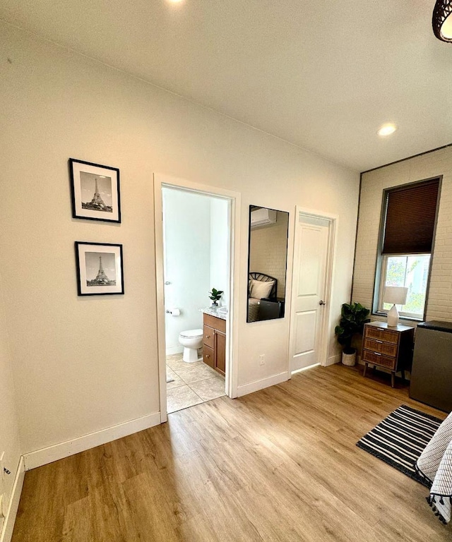 385 Fir St W, Madera, CA 93636 - hall featuring light wood-style floors, baseboards, and recessed lighting