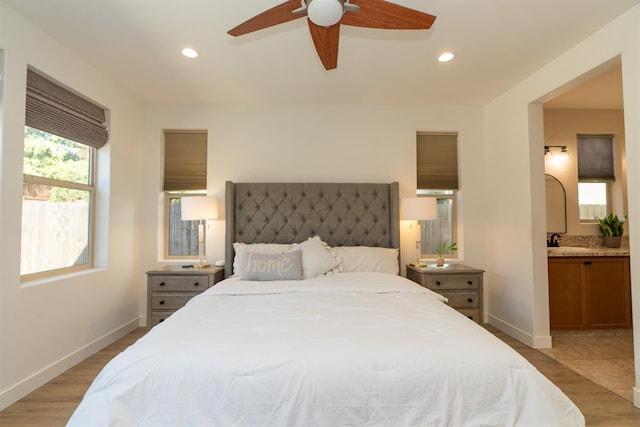 385 Fir St W, Madera, CA 93636 - bedroom with a sink, light wood finished floors, ensuite bathroom, recessed lighting, and baseboards