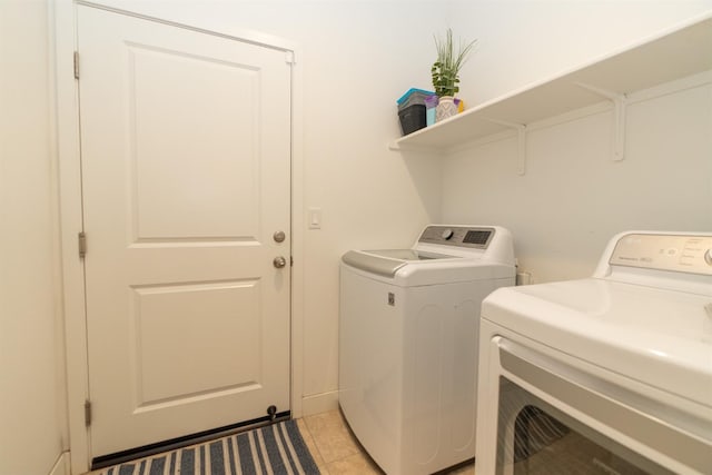 385 Fir St W, Madera, CA 93636 - laundry area with separate washer and dryer and light tile patterned flooring