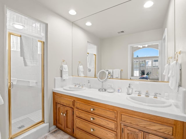 6424 N Allison Ln, Fresno, CA 93711 - bathroom featuring double vanity, a shower stall, and recessed lighting
