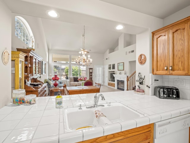 6424 N Allison Ln, Fresno, CA 93711 - kitchen featuring open floor plan, dishwasher, tile counters, a sink, and high vaulted ceiling