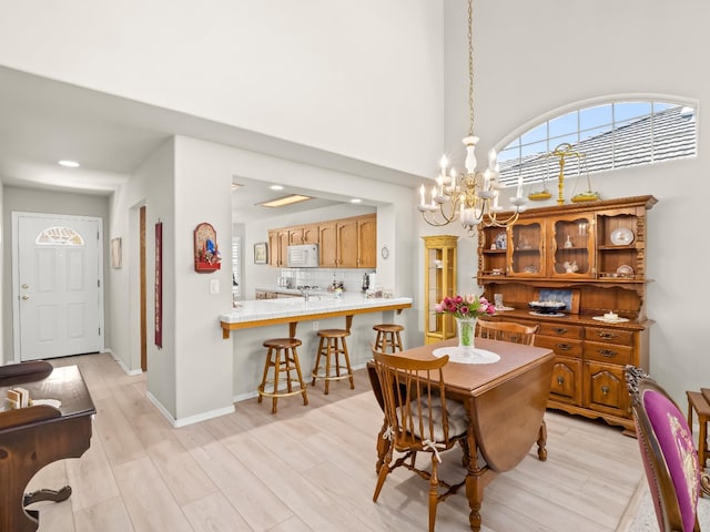 6424 N Allison Ln, Fresno, CA 93711 - dining area with a chandelier, light wood finished floors, and recessed lighting