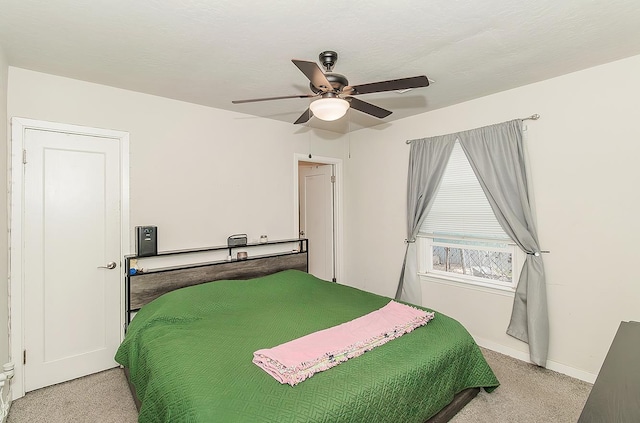 2216 E Floradora Ave, Fresno, CA 93703 - bedroom with light colored carpet, baseboards, and a ceiling fan