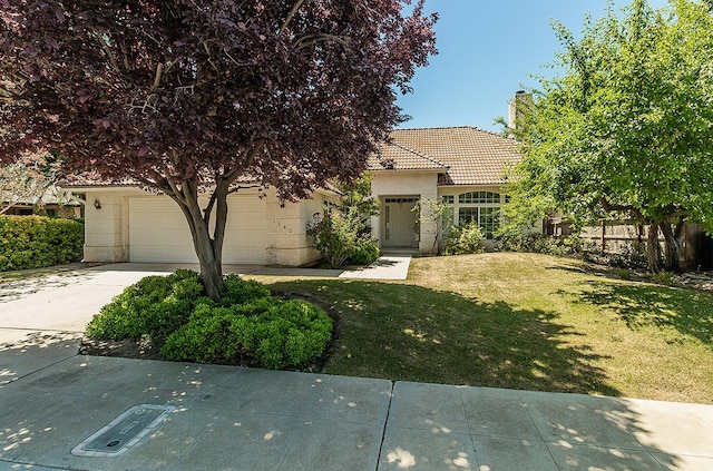 1783 E Pryor Dr, Fresno, CA 93720 - view of front of property with driveway, a chimney, a tiled roof, and stucco siding