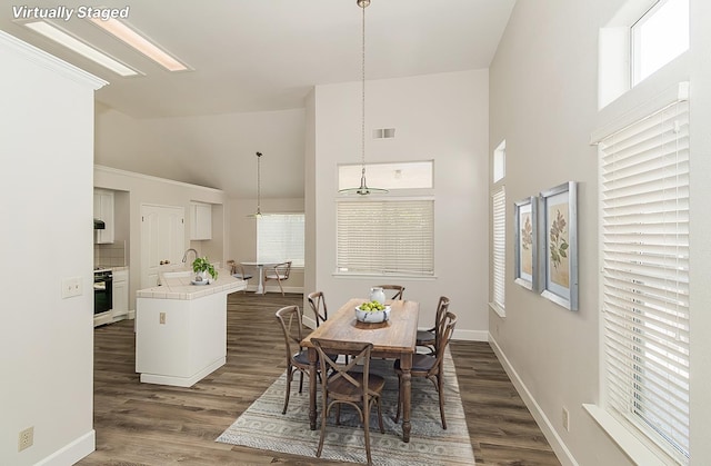 1783 E Pryor Dr, Fresno, CA 93720 - dining space featuring high vaulted ceiling, dark wood finished floors, and baseboards