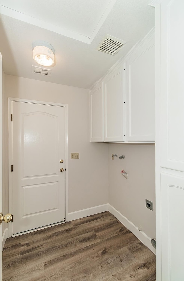 1783 E Pryor Dr, Fresno, CA 93720 - laundry area featuring cabinet space, hookup for an electric dryer, wood finished floors, and baseboards