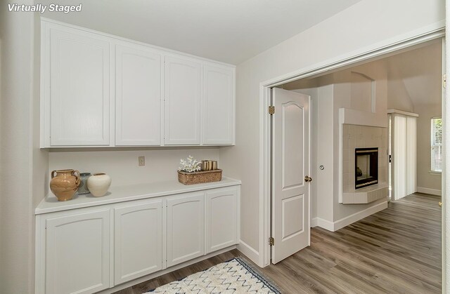 1783 E Pryor Dr, Fresno, CA 93720 - kitchen featuring light wood finished floors, white cabinetry, light countertops, and baseboards