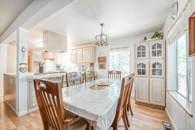 42357 Hanging Branch Rd, Shaver Lake, CA 93664 - dining space featuring light wood-type flooring and healthy amount of natural light