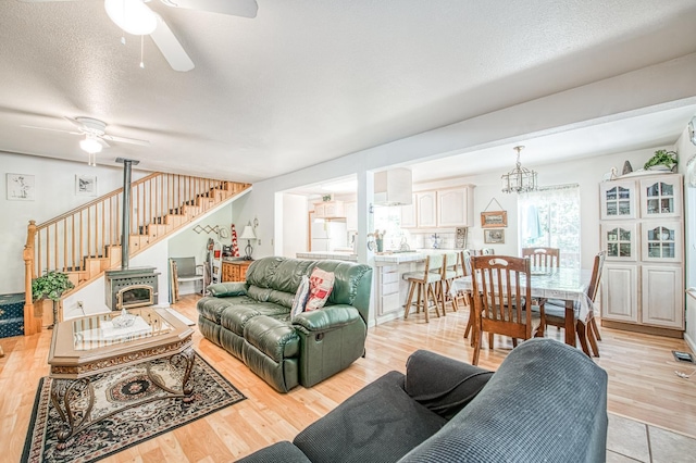 42357 Hanging Branch Rd, Shaver Lake, CA 93664 - living area featuring a ceiling fan, stairs, and light wood finished floors