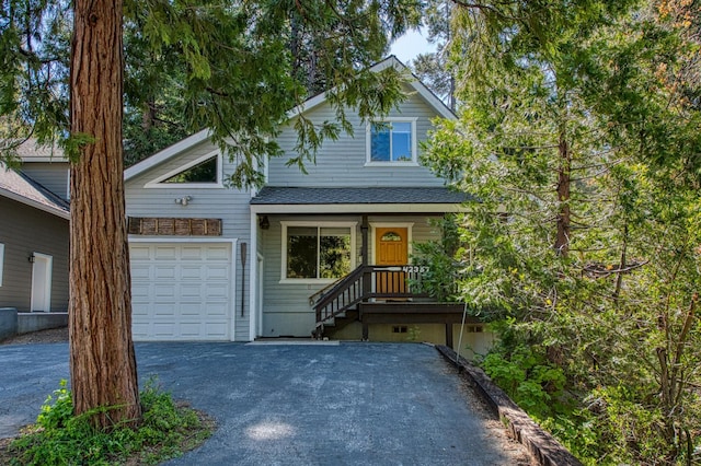 42357 Hanging Branch Rd, Shaver Lake, CA 93664 - view of front of home featuring a garage, asphalt driveway, and roof with shingles