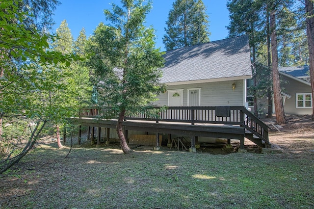 42357 Hanging Branch Rd, Shaver Lake, CA 93664 - back of house with a wooden deck, a shingled roof, and a yard