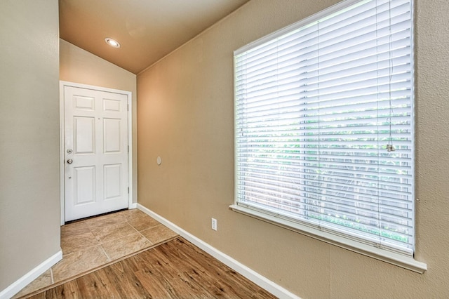 7518 N Trellis Cir, Fresno, CA 93720 - foyer featuring lofted ceiling, wood finished floors, and baseboards