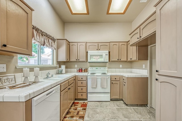 7518 N Trellis Cir, Fresno, CA 93720 - kitchen featuring white appliances, tile countertops, a sink, and light brown cabinetry