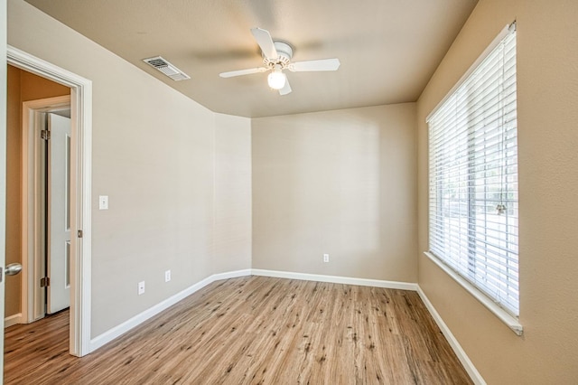7518 N Trellis Cir, Fresno, CA 93720 - spare room featuring wood finished floors, ceiling fan, and baseboards