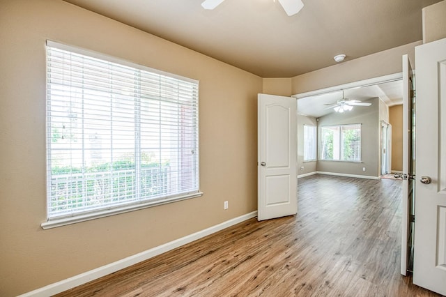 7518 N Trellis Cir, Fresno, CA 93720 - empty room featuring a ceiling fan, baseboards, and wood finished floors