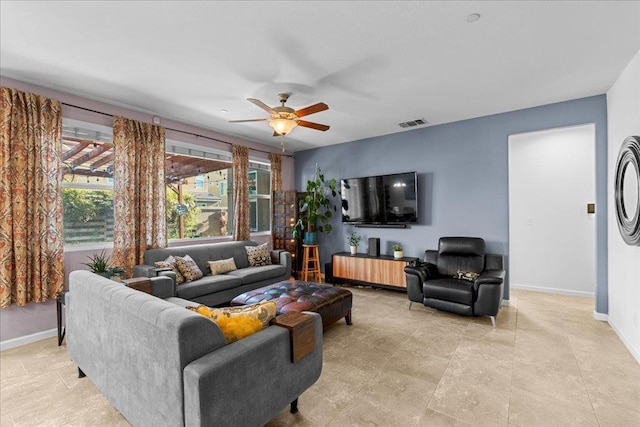 3930 Saginaw Ave, Clovis, CA 93619 - living room featuring baseboards and ceiling fan