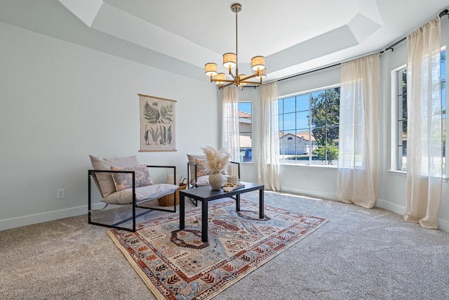 5642 W Beechwood Ave, Fresno, CA 93722 - living area with carpet flooring, a chandelier, baseboards, and a raised ceiling