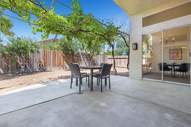 5642 W Beechwood Ave, Fresno, CA 93722 - fenced backyard with outdoor dining area and a patio
