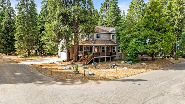 41208 Silver Pine Ln, Shaver Lake, CA 93664 - view of front of home with a porch, driveway, a garage, and stairs