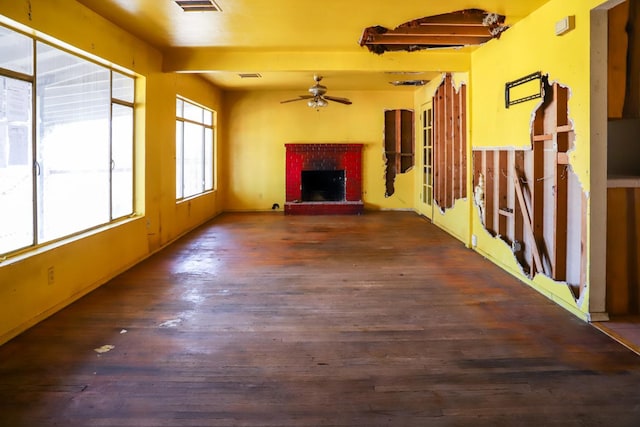 1315 W Fedora Ave, Fresno, CA 93705 - unfurnished living room with a ceiling fan, a fireplace, and wood finished floors