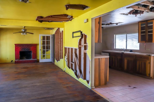 1315 W Fedora Ave, Fresno, CA 93705 - exterior space with ceiling fan, wood finished floors, and a brick fireplace