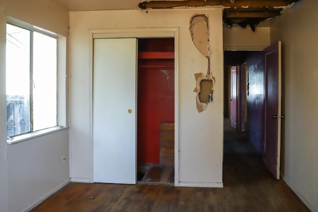 1315 W Fedora Ave, Fresno, CA 93705 - unfurnished bedroom with wood finished floors, multiple windows, and a closet
