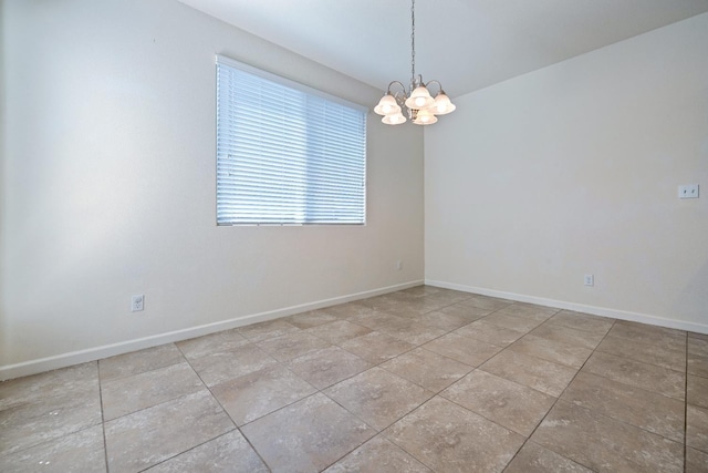 3834 Sussex Ave, Clovis, CA 93619 - spare room featuring a chandelier and baseboards