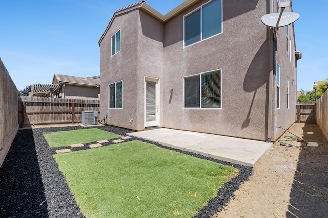 3834 Sussex Ave, Clovis, CA 93619 - back of property featuring central air condition unit, stucco siding, and a patio