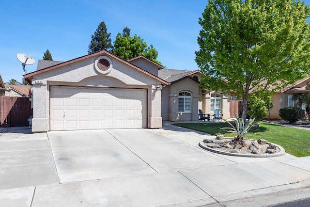 2903 Desert Ranch Way, Madera, CA 93637 - view of front of property with a garage, concrete driveway, and stucco siding