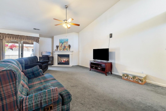 2903 Desert Ranch Way, Madera, CA 93637 - living room featuring lofted ceiling, carpet, a lit fireplace, a ceiling fan, and baseboards
