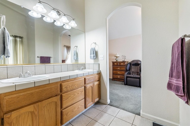 2903 Desert Ranch Way, Madera, CA 93637 - bathroom featuring tile patterned floors, double vanity, and baseboards