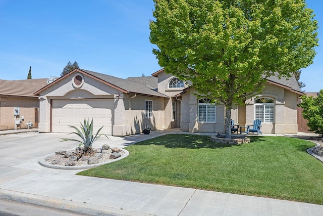 2903 Desert Ranch Way, Madera, CA 93637 - view of front of home with stucco siding, an attached garage, driveway, and a front yard