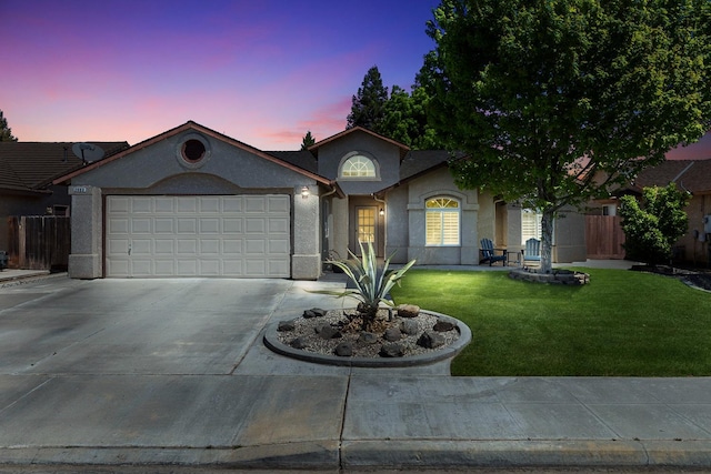 2903 Desert Ranch Way, Madera, CA 93637 - ranch-style house with stucco siding, driveway, and a garage