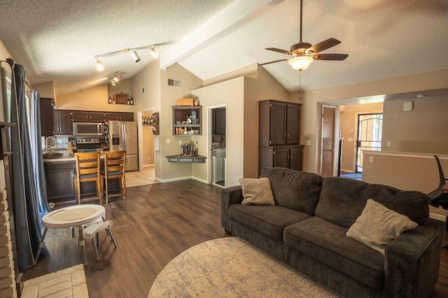 1603 E Serena Ave, Fresno, CA 93720 - living area with a textured ceiling, dark wood-style flooring, a ceiling fan, and baseboards