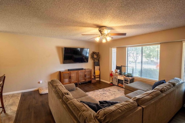 1603 E Serena Ave, Fresno, CA 93720 - living area featuring a ceiling fan, baseboards, a textured ceiling, and wood finished floors