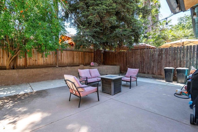 1603 E Serena Ave, Fresno, CA 93720 - fenced backyard with a patio area and an outdoor living space with a fire pit
