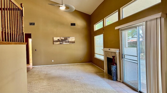 5346 W Flint Way, Fresno, CA 93722 - unfurnished living room featuring high vaulted ceiling, plenty of natural light, a ceiling fan, and carpet