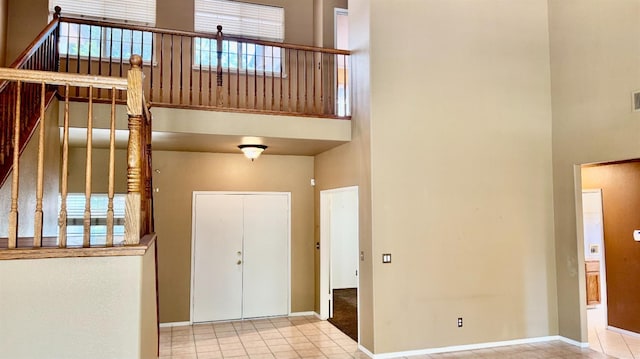 5346 W Flint Way, Fresno, CA 93722 - entryway with a towering ceiling, tile patterned flooring, and baseboards