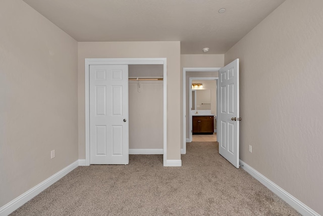 43 E Florence Ave, Fresno, CA 93706 - unfurnished bedroom featuring light colored carpet, baseboards, and a closet